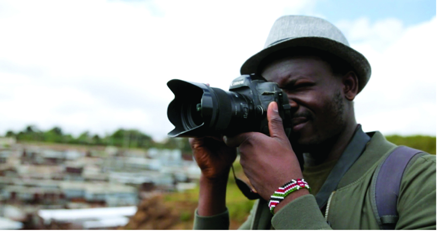 a photographer in Kibera, a large township in Nairobi, Kenya