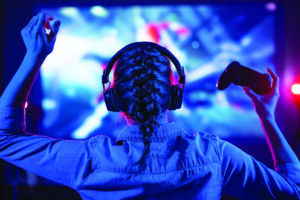 Young woman playing a videogame